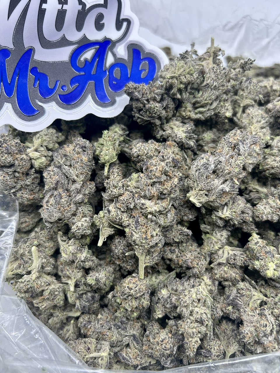 Buy Jelly Roll strain online — bright green buds with purple flecks and sticky resin from NTTD Mr. Aob