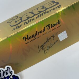 OG Cake Legendary Gold 2g disposable vape with gold packaging and golden oil